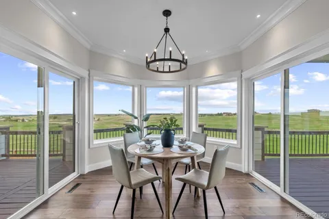 a kitchen with a table and chairs