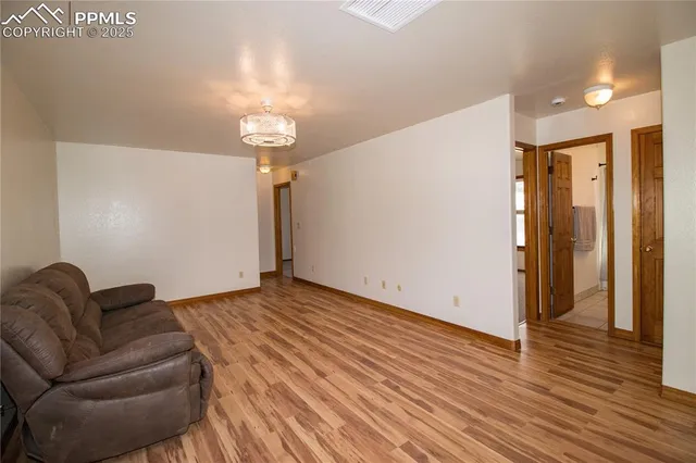 a view of livingroom with furniture and wooden floor