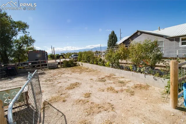 a view of a backyard of the house
