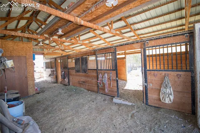 a view of a room with wooden walls