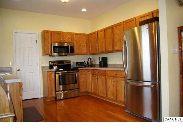 15 Old Farm Road Ruckersville, VA 22968 - Photo 5 of 18 a kitchen with stainless steel appliances a refrigerator and a stove top oven