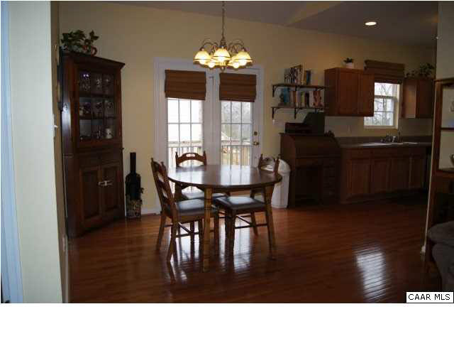 15 Old Farm Road Ruckersville, VA 22968 - Photo 7 of 18 a kitchen with dining table and chairs