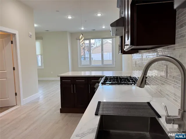 a kitchen with a stove and a microwave