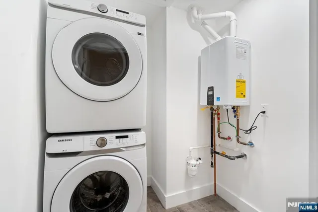 a view of a hallway with washer and dryer