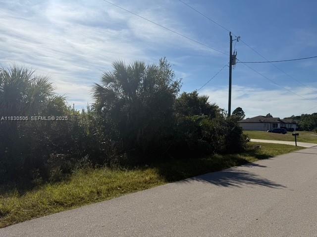 3207 53rd Street West Lehigh Acres, FL 33971 - Photo 7 of 8 a view of a street