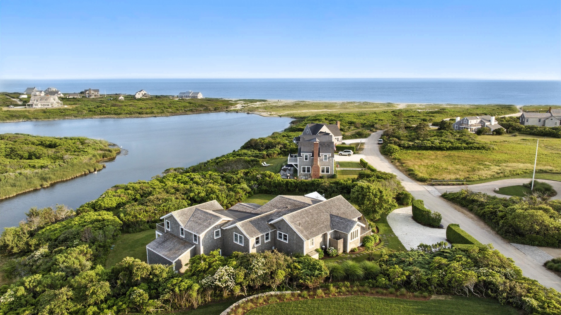 45 Starbuck Road Nantucket, MA 02554 - Photo 1 of 42 an aerial view of a house with a lake view