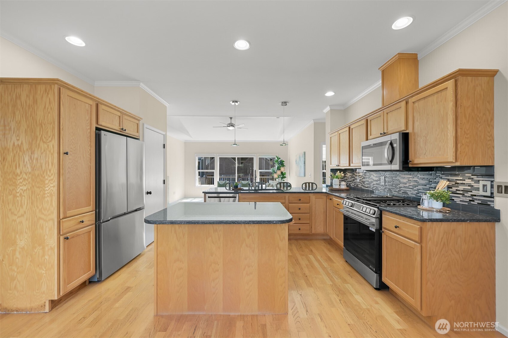 500 Fieldstone Loop, Unit 14 Lynden, WA 98264 - Photo 11 of 25 a large kitchen with stainless steel appliances granite countertop a sink refrigerator and cabinets