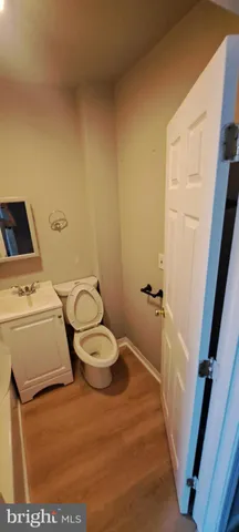 a white toilet sitting next to a sink