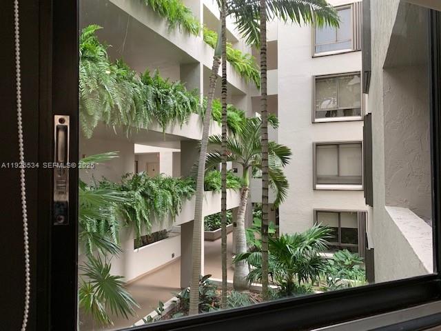 141 Crandon Boulevard, Unit 237 Key Biscayne, FL 33149 - Photo 32 of 38 a front view of a house with a yard