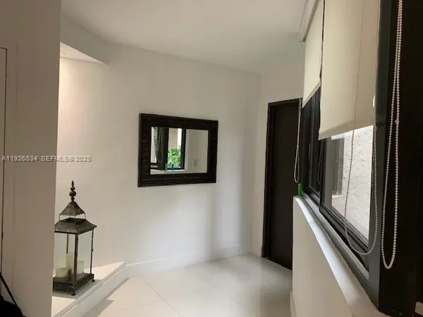 a view of a hallway with washer and dryer