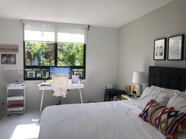 141 Crandon Boulevard, Unit 237 Key Biscayne, FL 33149 - Photo 37 of 38 a bed room with a bed and a large window