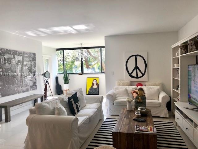 141 Crandon Boulevard, Unit 237 Key Biscayne, FL 33149 - Photo 38 of 38 a living room with furniture and a large window