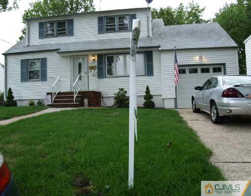 71 Middle Hill Road Colonia, NJ 07067 - Photo 1 of 10 a view of a house with a yard