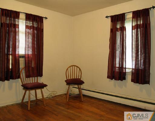71 Middle Hill Road Colonia, NJ 07067 - Photo 4 of 10 a view of a livingroom with furniture and window