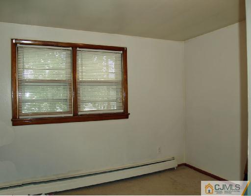 71 Middle Hill Road Colonia, NJ 07067 - Photo 5 of 10 a view of a room that has a window in it