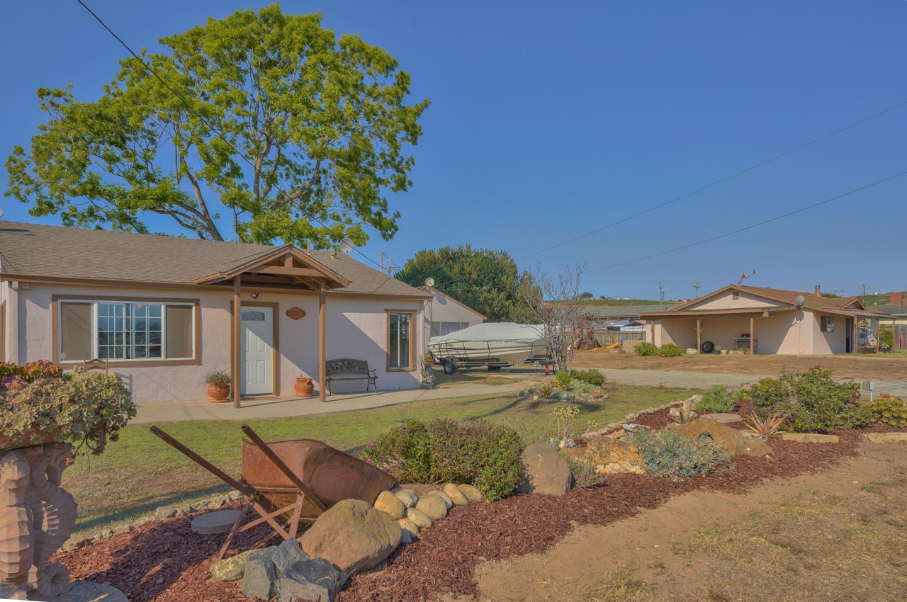 a front view of a house with garden