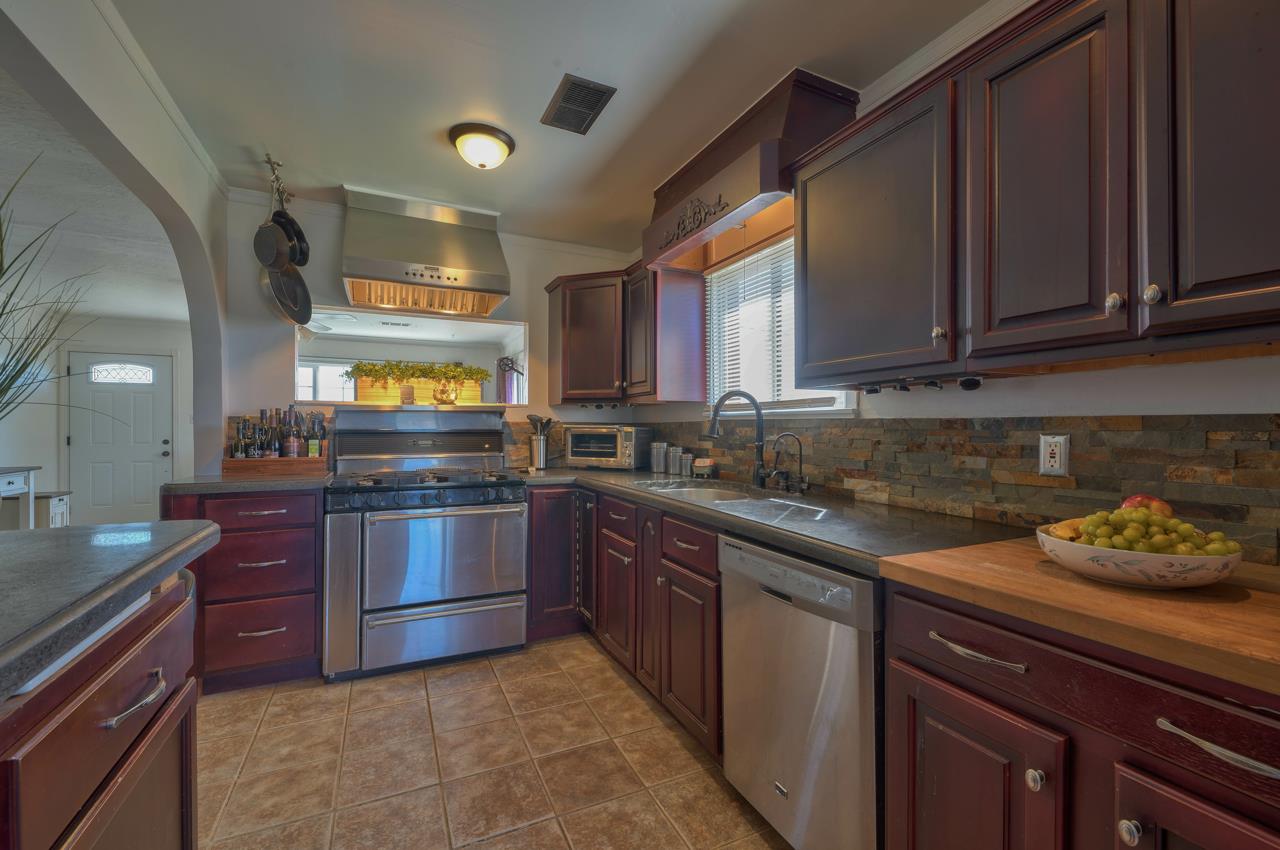 14485 Russo Road Castroville, CA 95012 - Photo 15 of 55 a kitchen with stainless steel appliances granite countertop a sink and stove