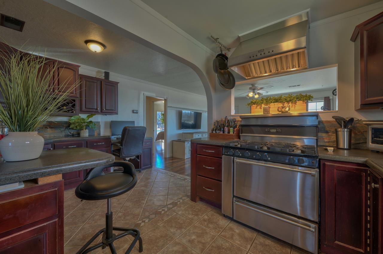 14485 Russo Road Castroville, CA 95012 - Photo 16 of 55 a kitchen with a stove and a refrigerator