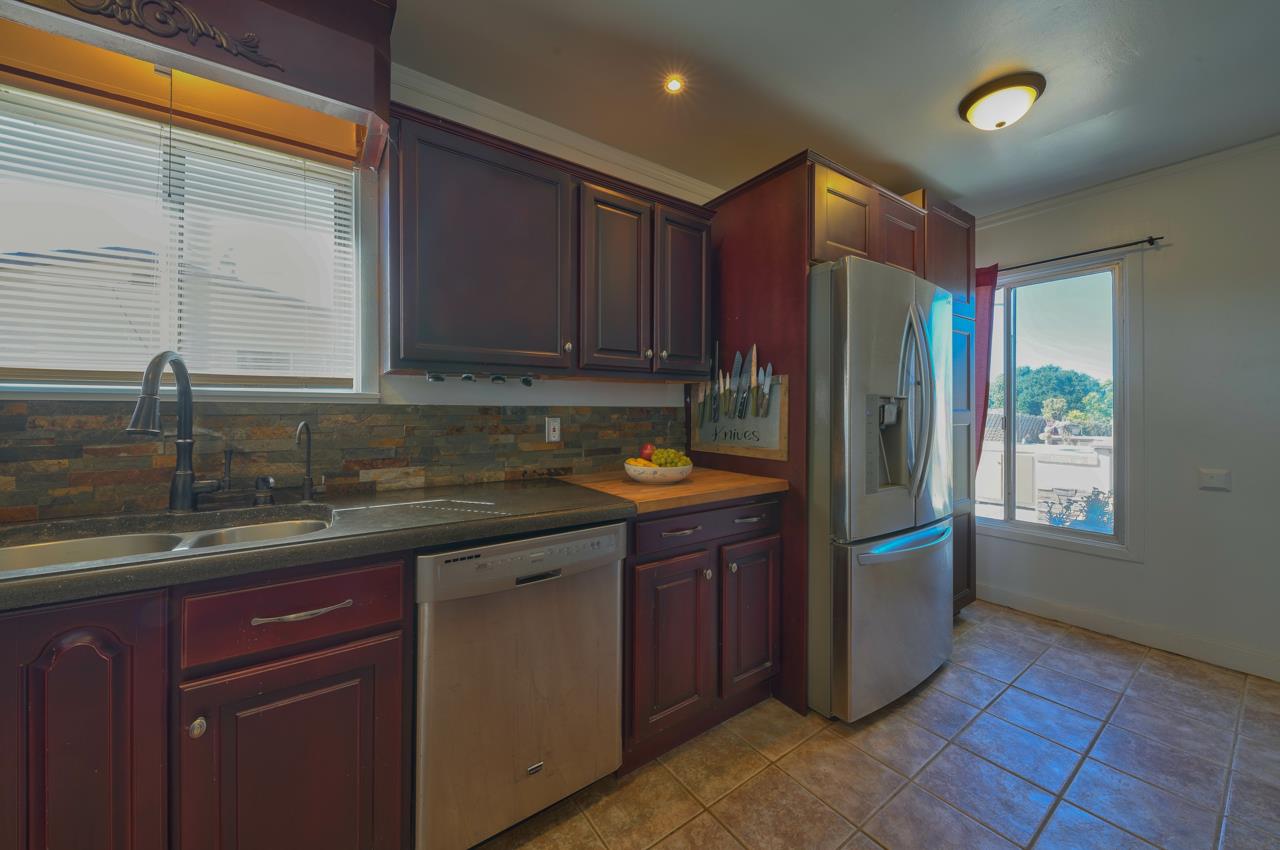 14485 Russo Road Castroville, CA 95012 - Photo 17 of 55 a kitchen with stainless steel appliances granite countertop a sink stove and refrigerator