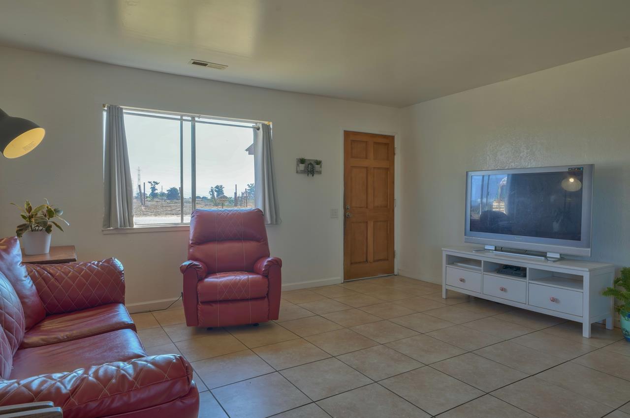 14485 Russo Road Castroville, CA 95012 - Photo 30 of 55 a living room with furniture and a flat screen tv