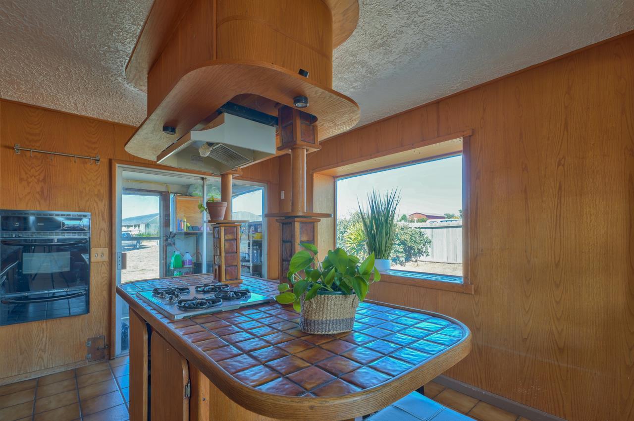 14485 Russo Road Castroville, CA 95012 - Photo 33 of 55 a dining room with a table and chairs