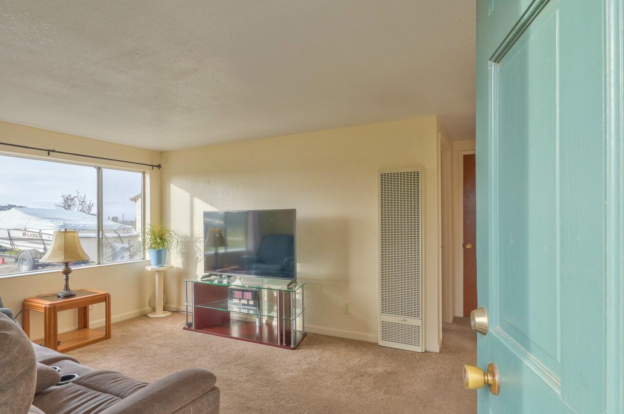 14485 Russo Road Castroville, CA 95012 - Photo 42 of 55 a living room with furniture and a flat screen tv