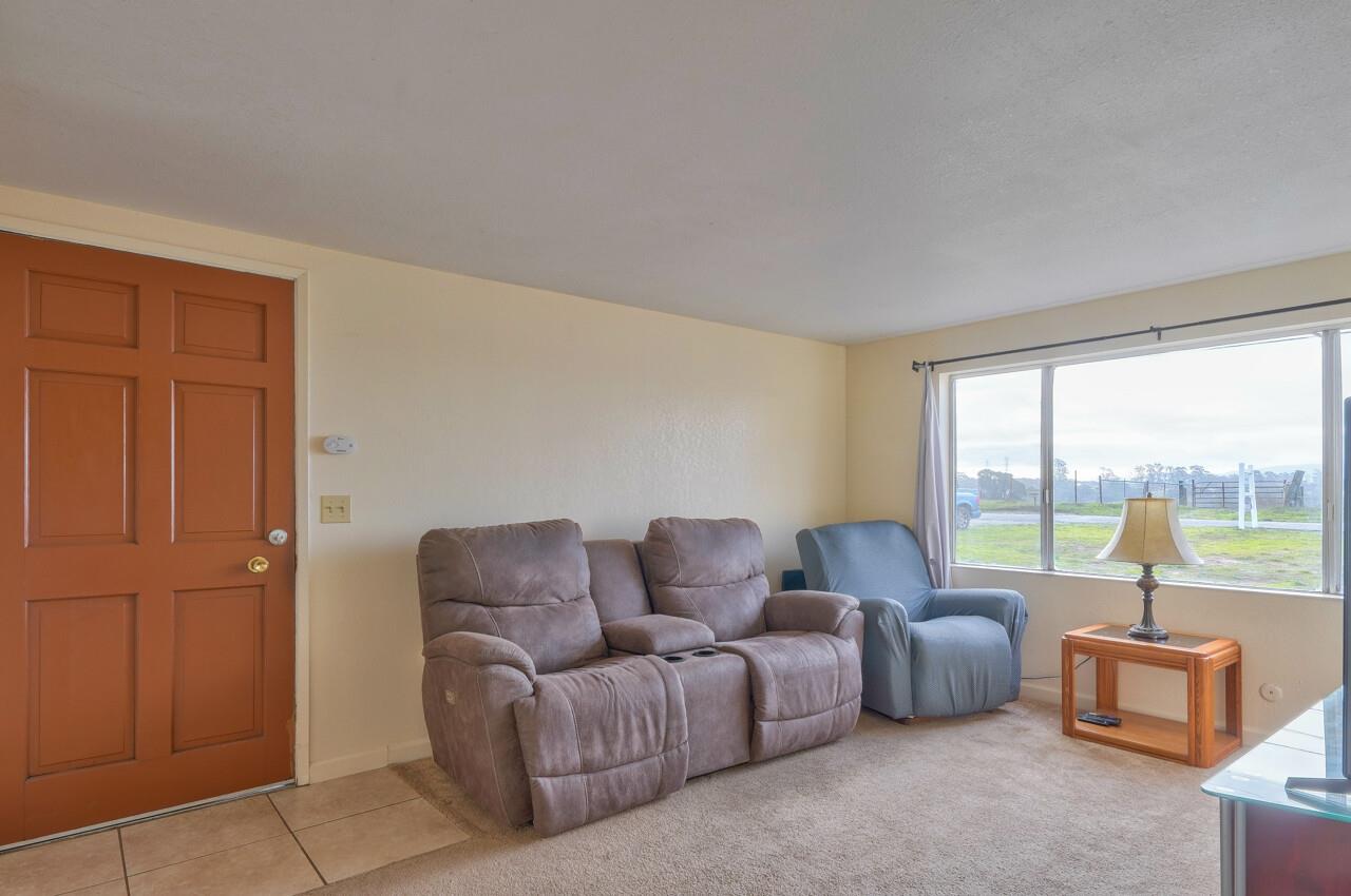 14485 Russo Road Castroville, CA 95012 - Photo 43 of 55 a living room with furniture and a floor to ceiling window