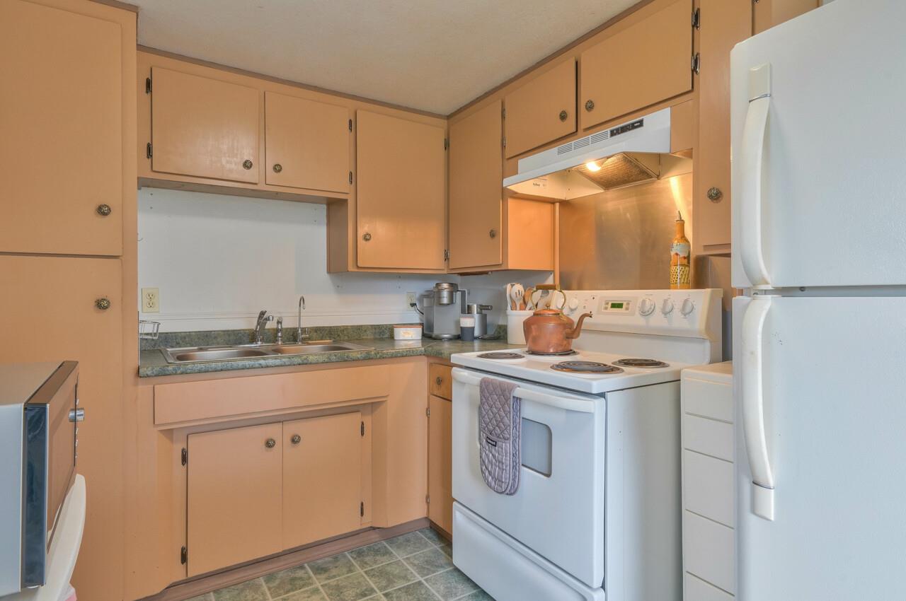 14485 Russo Road Castroville, CA 95012 - Photo 45 of 55 a kitchen with a sink stove and cabinets