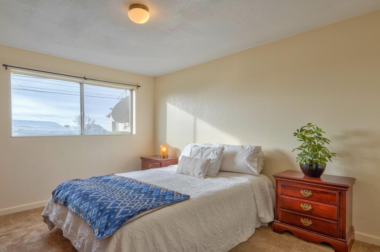 14485 Russo Road Castroville, CA 95012 - Photo 47 of 55 a bedroom with a bed and a potted plant