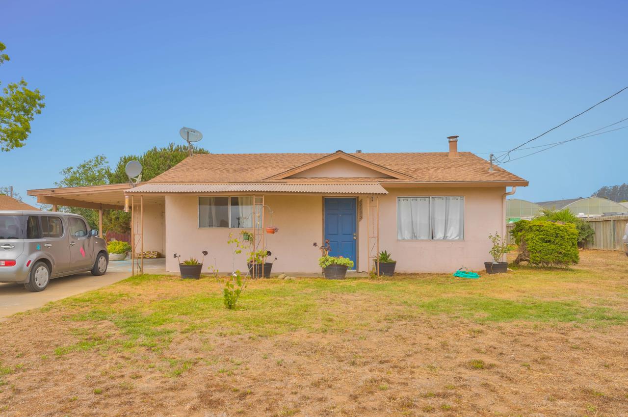 14485 Russo Road Castroville, CA 95012 - Photo 7 of 55 a front view of a house with a yard and garage