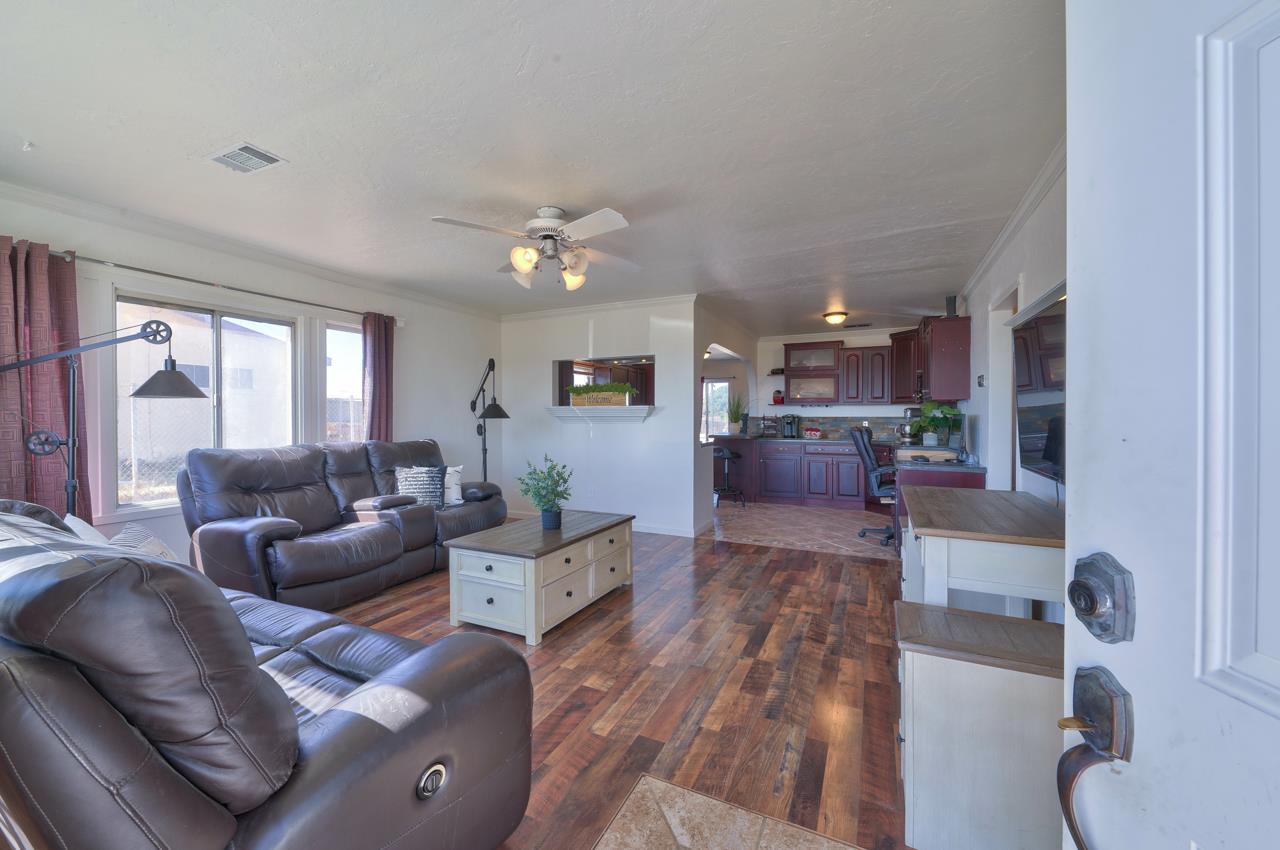 14485 Russo Road Castroville, CA 95012 - Photo 9 of 55 a living room with furniture and a chandelier