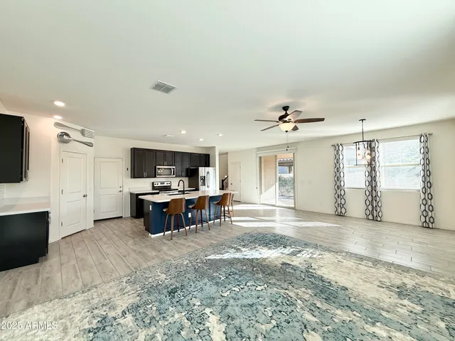 a view of a livingroom with furniture and a flat screen tv