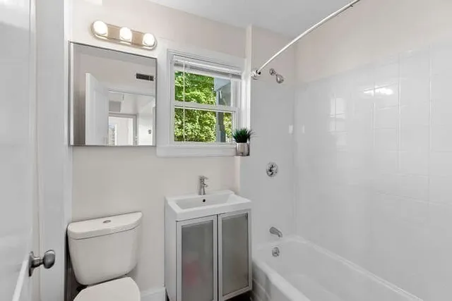 a bathroom with a toilet sink and bathtub