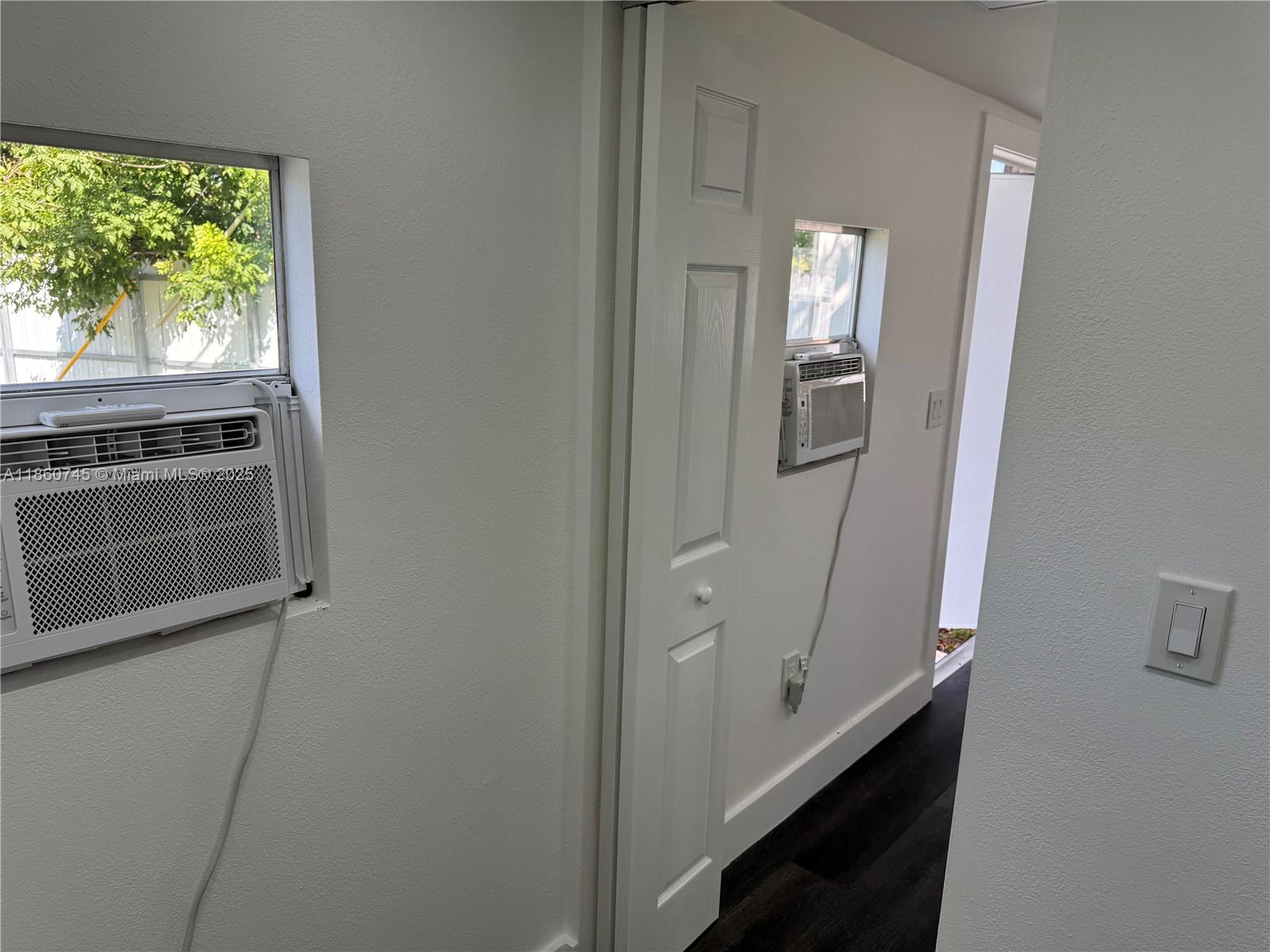 11751 Southwest 190th Terrace, Unit 1A Miami, FL 33177 - Photo 4 of 8 a bathroom with a double vanity sink and a mirror