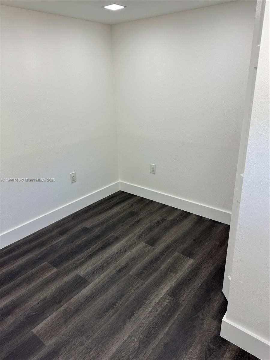 11751 Southwest 190th Terrace, Unit 1A Miami, FL 33177 - Photo 7 of 8 a view of small space with wooden floor