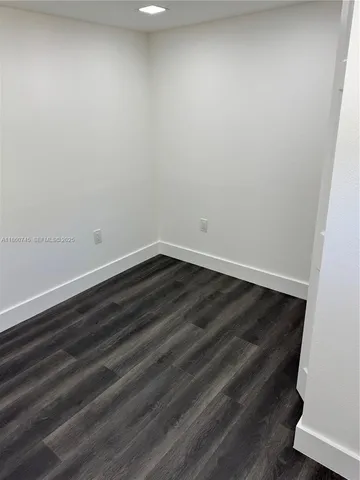 a view of small space with wooden floor