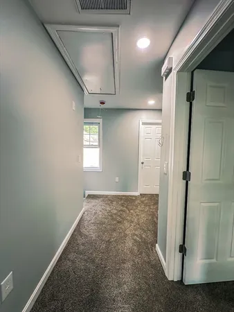 a view of an empty room and window