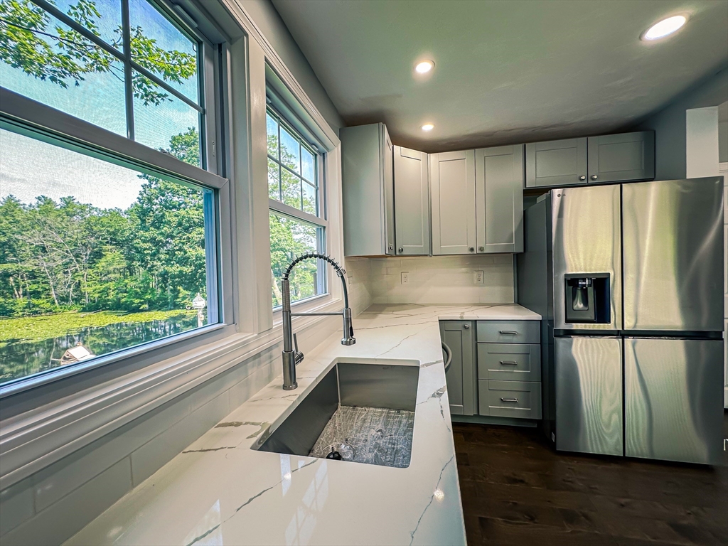 14 Hillside Road Northborough, MA 01532 - Photo 5 of 13 a kitchen with granite countertop a refrigerator and a sink