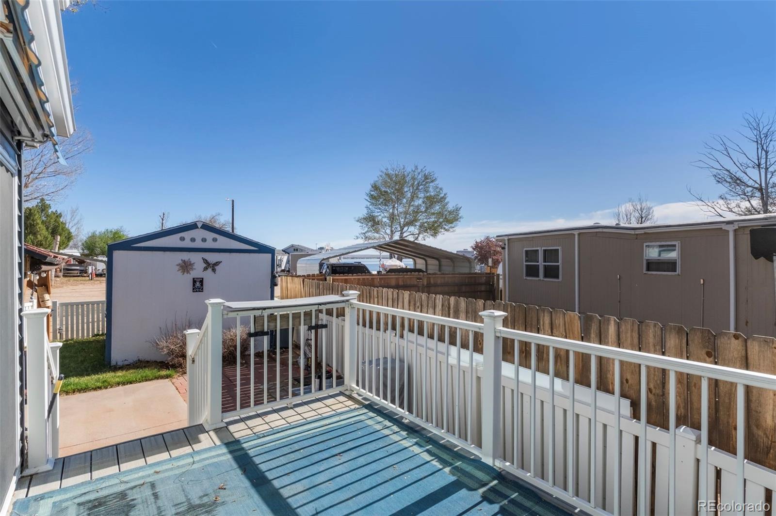 188 Kiowa Road Weldona, CO 80653 - Photo 18 of 34 a view of a balcony with wooden floor