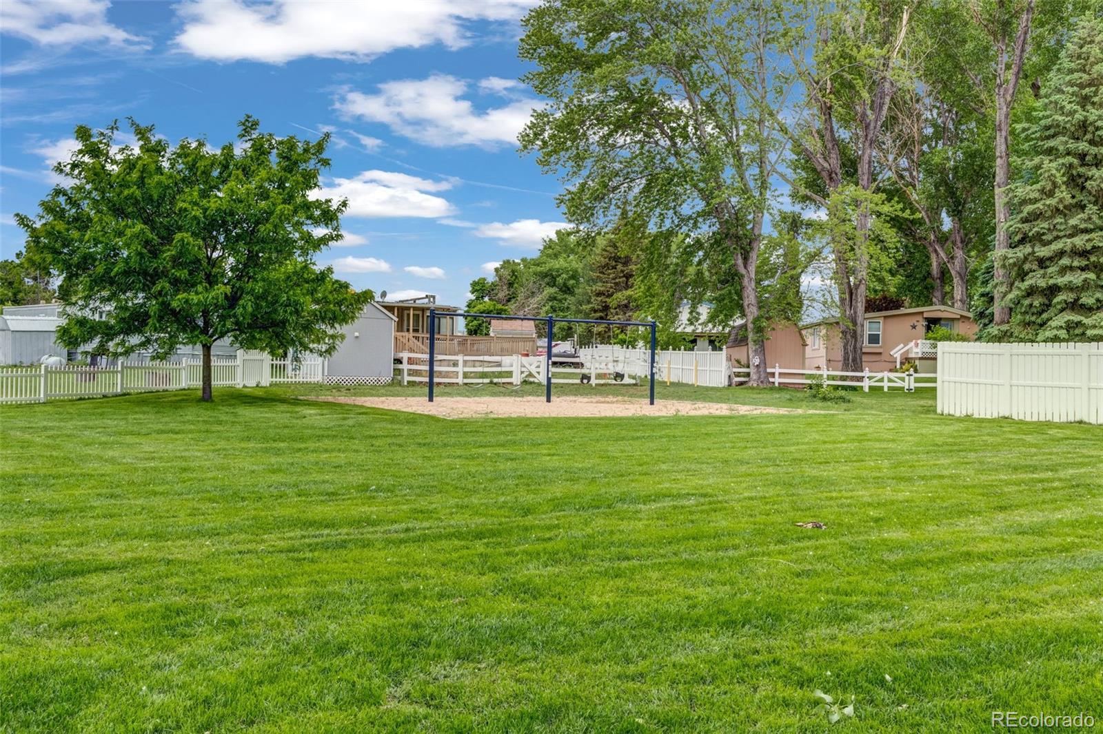 188 Kiowa Road Weldona, CO 80653 - Photo 20 of 34 a view of a park with a tree in the background