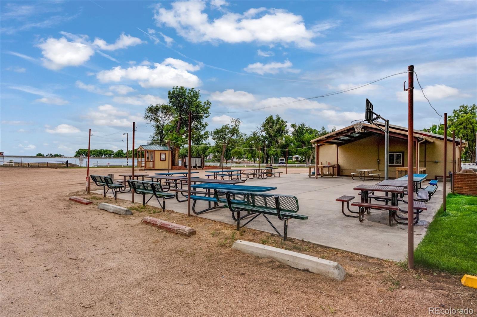 188 Kiowa Road Weldona, CO 80653 - Photo 23 of 34 a view of a patio with a table and chairs