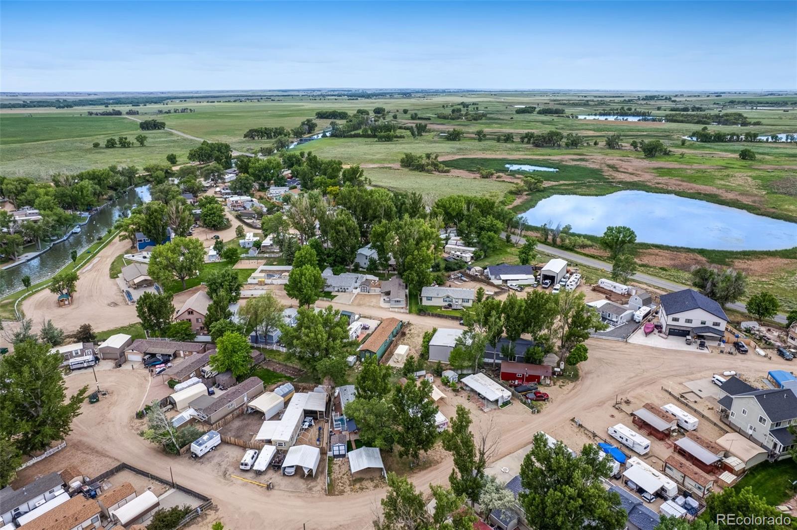 188 Kiowa Road Weldona, CO 80653 - Photo 29 of 34 an aerial view of beach and residential houses with outdoor space and river