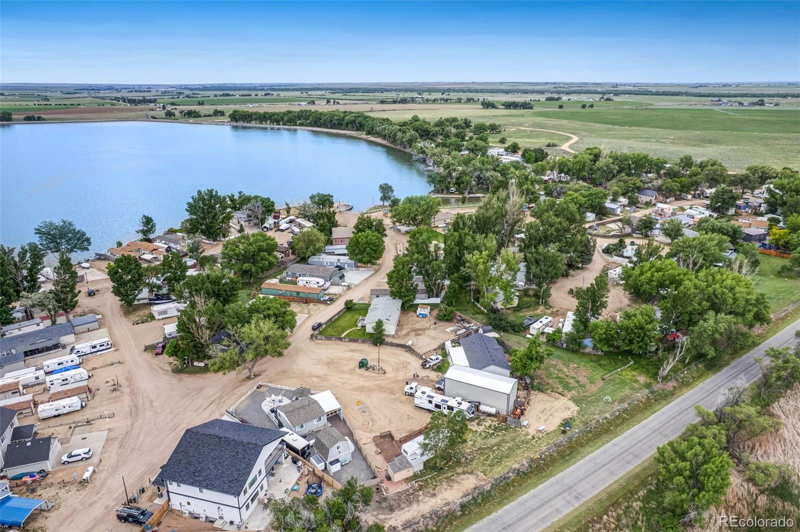 188 Kiowa Road Weldona, CO 80653 - Photo 30 of 34 an aerial view of beach and residential houses with outdoor space