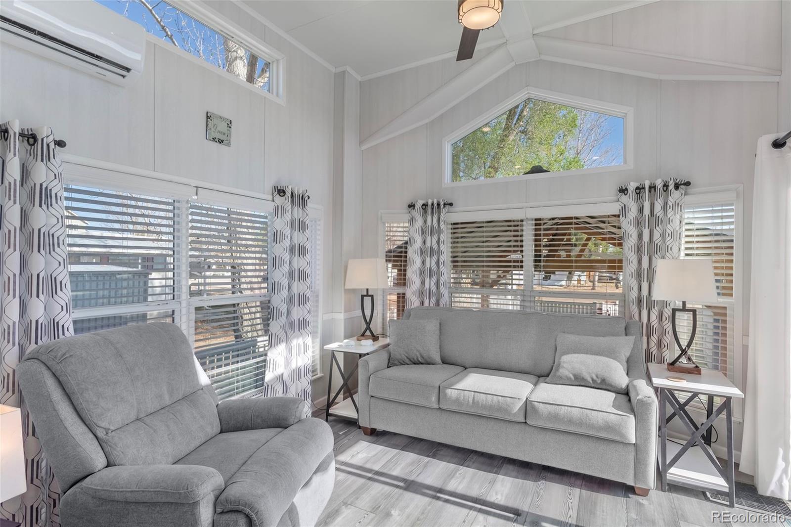 188 Kiowa Road Weldona, CO 80653 - Photo 4 of 34 a living room with furniture and a large window