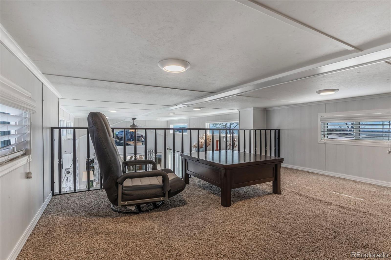 188 Kiowa Road Weldona, CO 80653 - Photo 10 of 34 a view of a room with furniture and a window