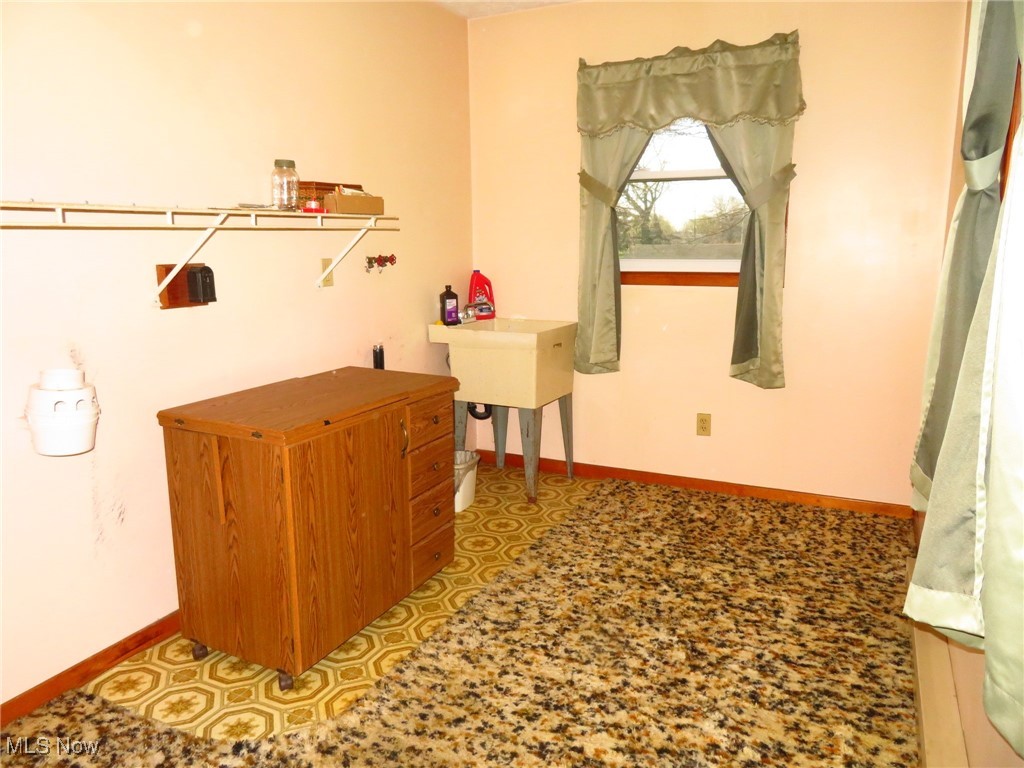38505 Sugar Ridge Road North Ridgeville, OH 44039 - Photo 23 of 44 The laundry room is on the main living floor and has a convenient laundry tub as well