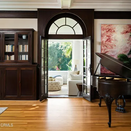 a view of sitting area with furniture and wooden floor