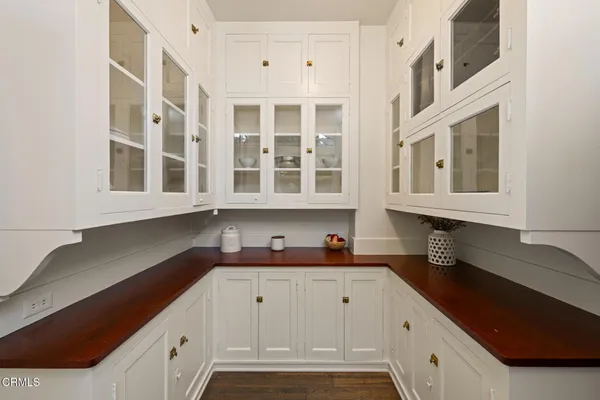 a kitchen with stainless steel appliances kitchen island granite countertop a stove a sink and a refrigerator