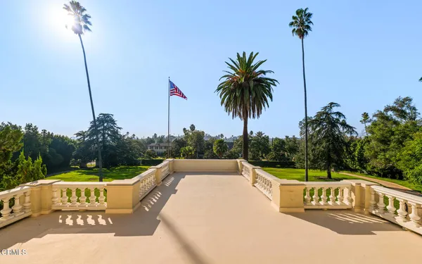 a view of a livingroom with furniture and staircase