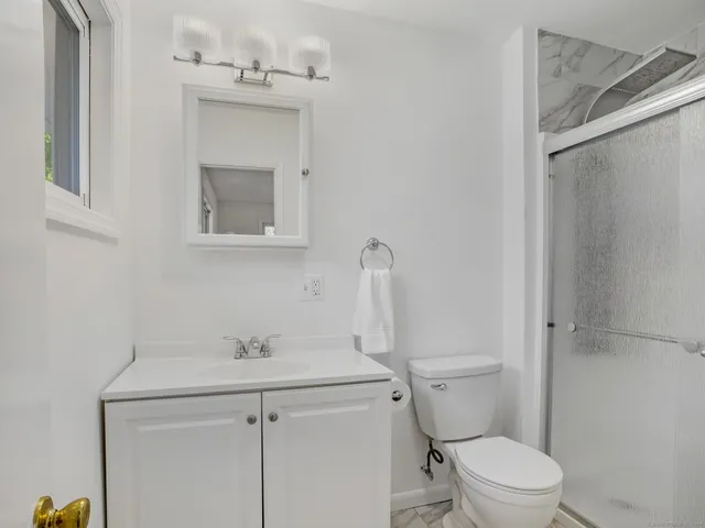 a bathroom with a sink toilet and vanity